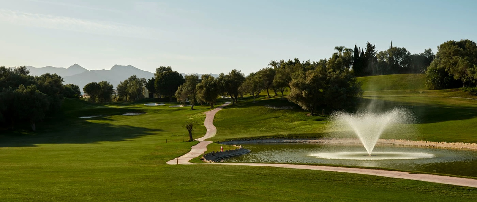 Marbella Golf & Country Club landscape with greens and clubhouse in Marbella East