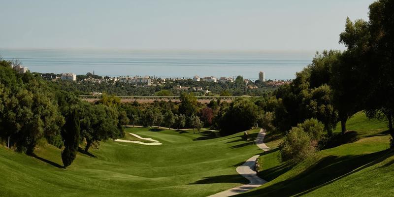Greenlife Golf at Elviria Hills with water feature and natural surroundings